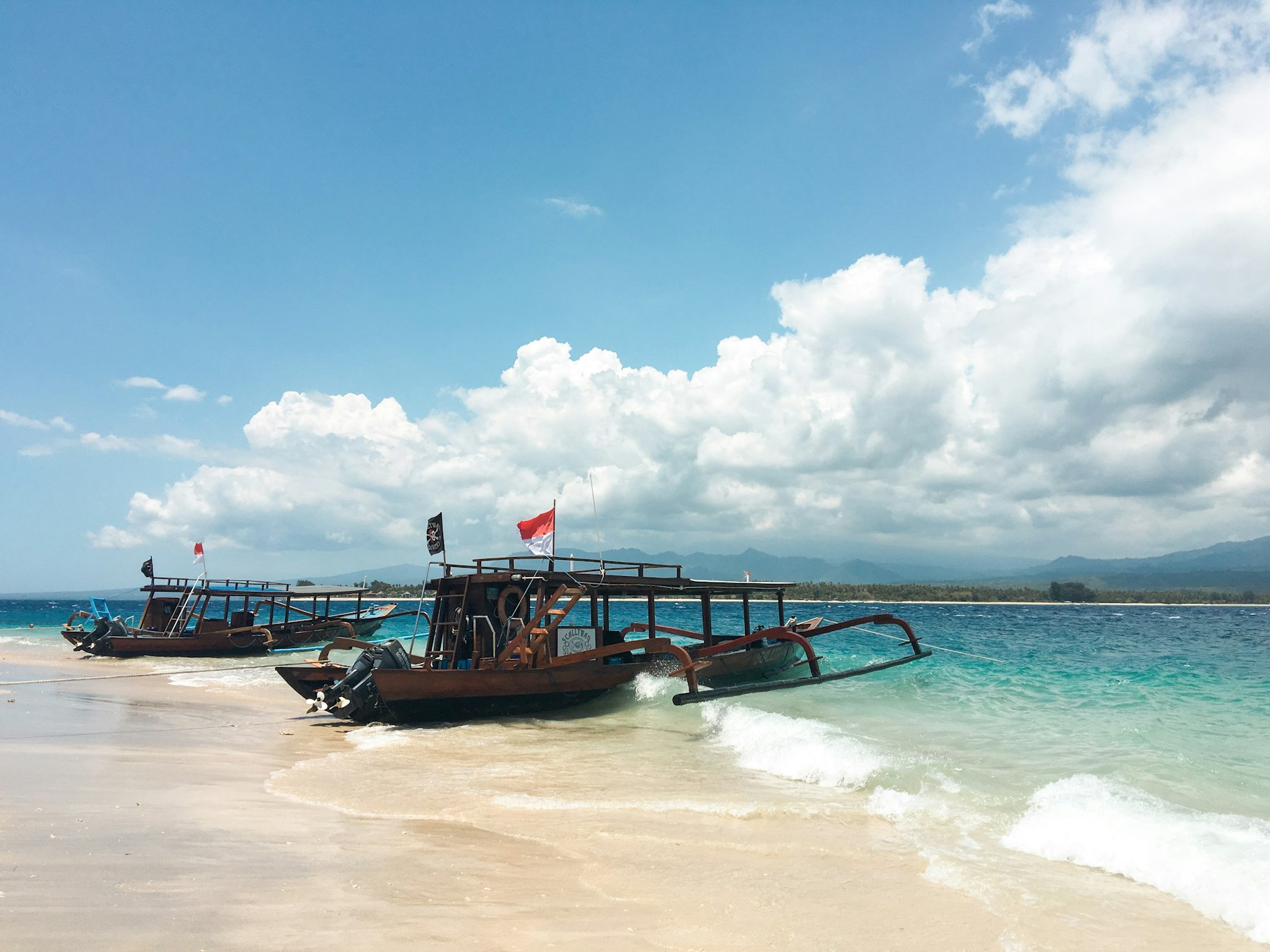 Traditional wooden boat on the shore near Lombok